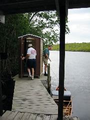 Doug taking stock, Jim tying canoes